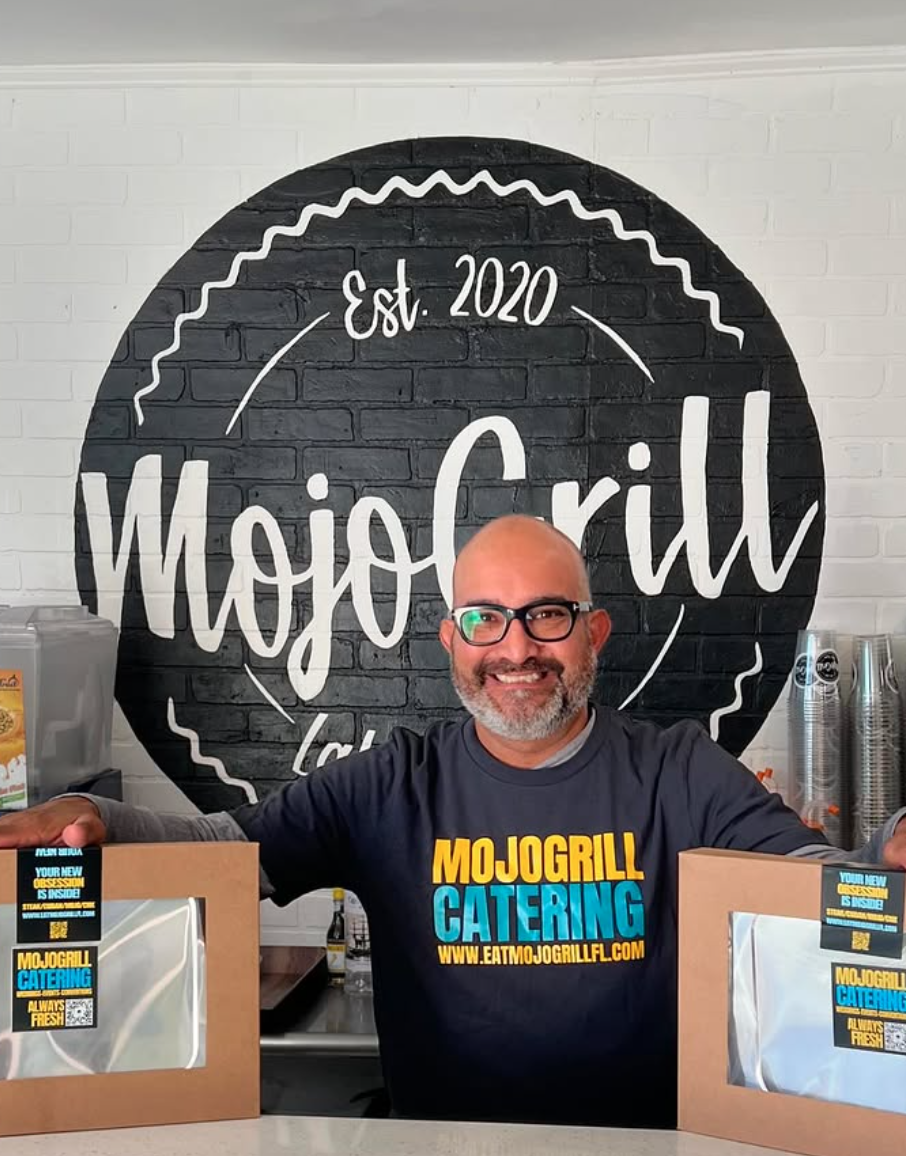 Luis with catering boxes